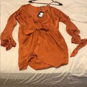 Satin wrap dress with open sleeves and wrist ties